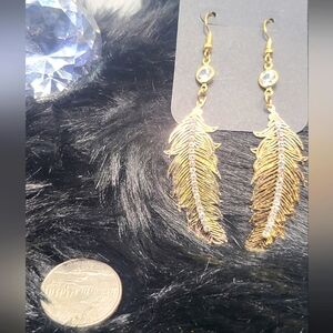 (New) Long Blingy Gold Feather Shape Earrings